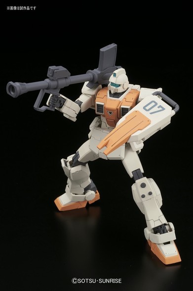 light tan and light orange robotic figure with a bazooka cannon on his shoulder