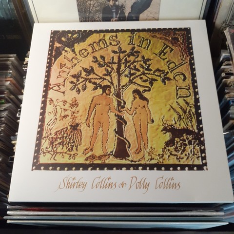 Album cover features an illustration of Adam and Eve under an apple tree.  A snake is coiled around the tree.