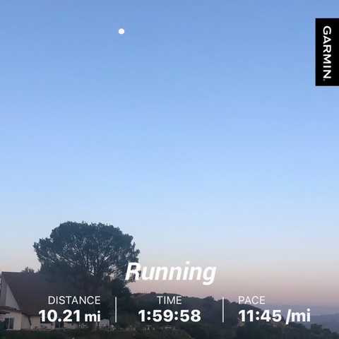 Photo of landscape, tree, and moon with running stats: distance - 10.21 miles; time - 1:59:58; pace - 11:45/mile
