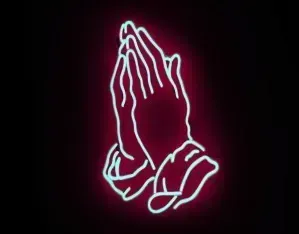 Praying hands etched in neon pink