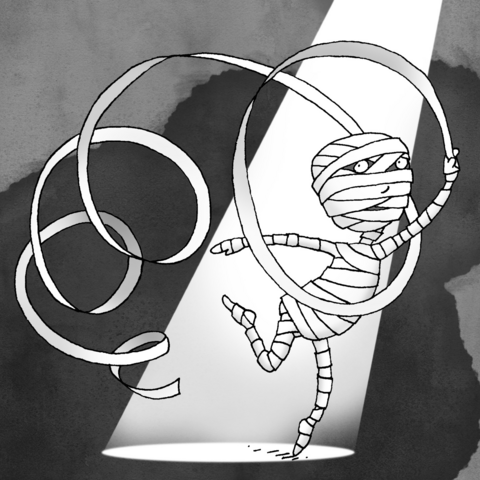 A mummy performing a ribbon dance in a spotlight