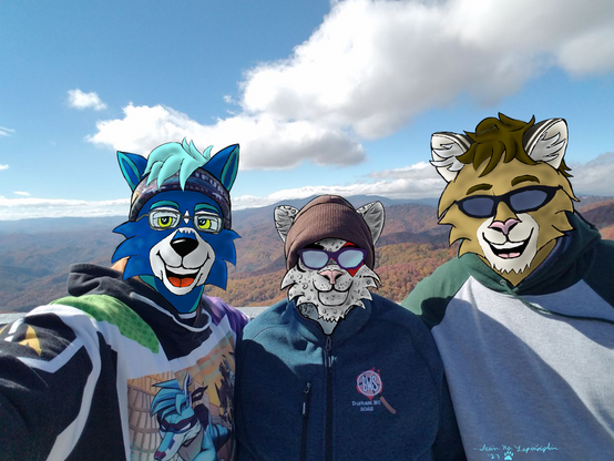 From left to right:
Seán a blue wolf takes a selfie with his mom, Luna Polaris (a Phaeline of the snow leopard clan with a black moon-shaped mark around her right eye and a red four-pointed star over her left eye), and his dad, Pádraig O'Meadhra (a Phaeline of the puma clan).
They are dressed warmly with a beautiful view of the fall colors in the mountains behind them. Luna and Pádraig are wearing sunglasses, while Seán wears prescription glasses.
Pádraig is wearing a gray and dark green hoodie. Seán is wearing a Furality Legends hoodie, while Luna wears a fleece jacket from Bewhiskered 2022.