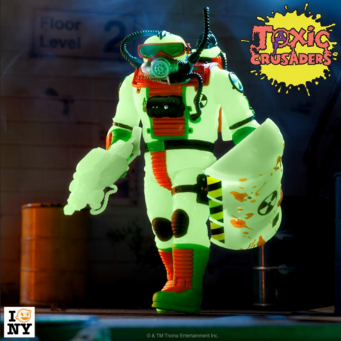 a photo of an action figure, it is glow-in-the-dark, bright green, he has a shield, a gun, and a breathing apparatus and mask like a scuba diver