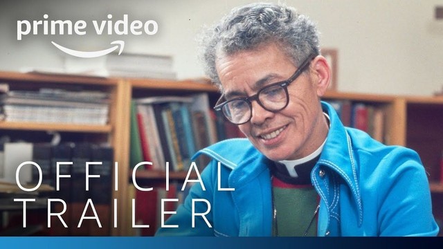 photo of Pauli Murray, a mixed race person with short grey hair and glasses. Pauli is wearing attire that reflects their status as a Christian priest - ie a dog collar and cross. Text says 'Prime Video Official Trailer'