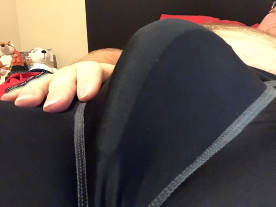 Held my camera pointing up closely facing my crotch. A close up view from below my black compression shorts showing the contour of the cup inside and and just to the side.