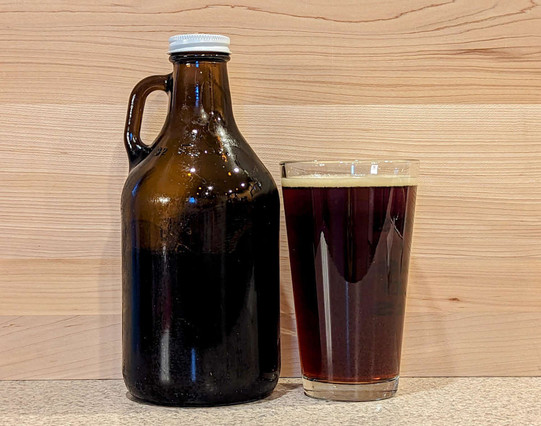 A growler bottle and glass of Pumpkin Spice Brown Ale from Bridge 99 Brewery of Bend, Oregon