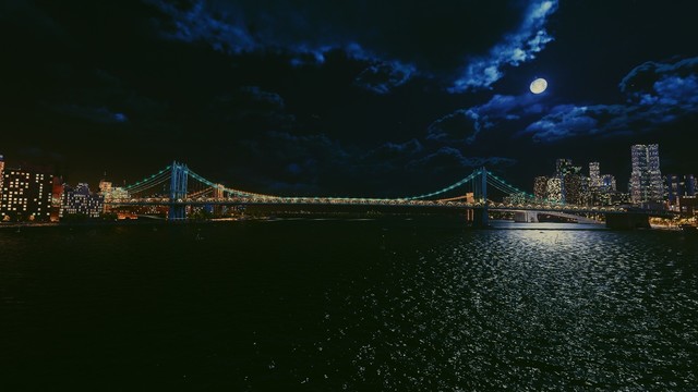 Spider-Man 2 screenshot of the Manhattan Bridge at night taken from the river