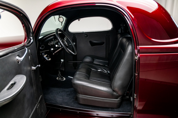the door is opened, the interior of the car is dark silver colored