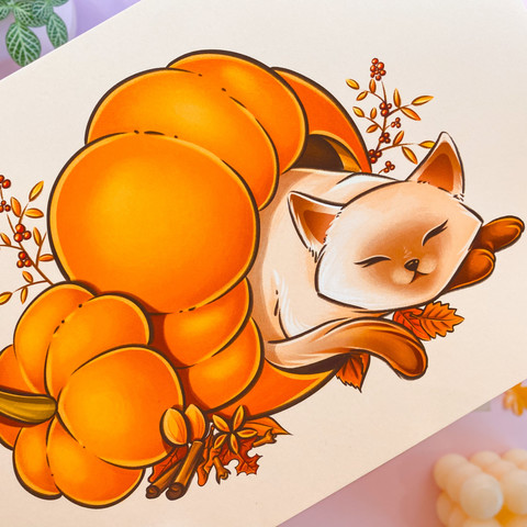 A photo of a print of a cute siamese cat sleeping inside a huge pumpkin. The cat is surrounded by spices and the background is a soft beige. She's called pumpkin spice.