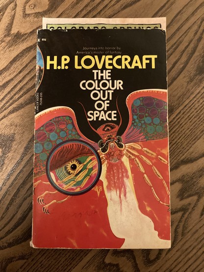 Vintage paperback with a weird flying creature on the front. The Colour Out Of Space by H.P. Lovecraft.