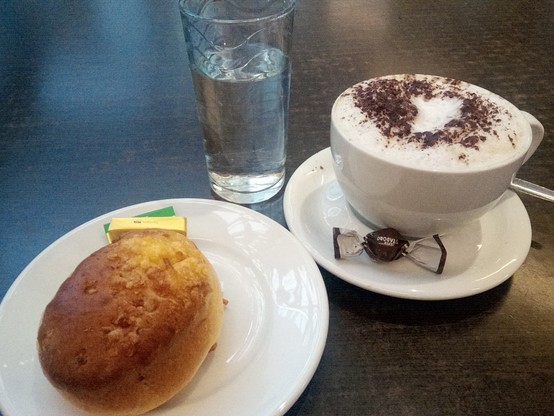 A cheese scone (or cheese-a-sconn in Italian!) with cappuccino, chocolate fancy and chilled water