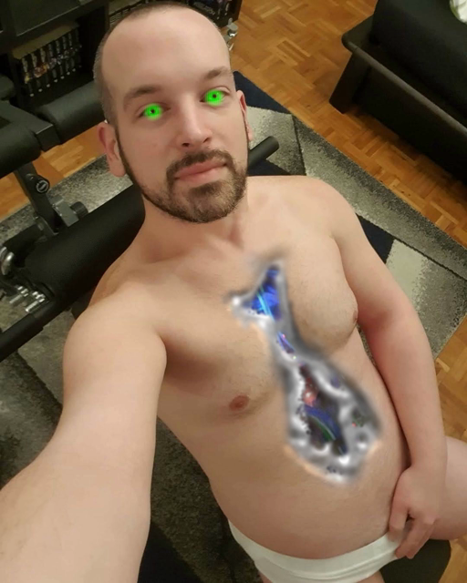 a smooth chested German android with a beard has its chest slashed open revealing metal framing and robotics underneath. it is grabbing its robotic crotch which is in white briefs