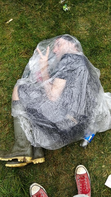 Wrapped in a poncho and wellies at Glastonbury