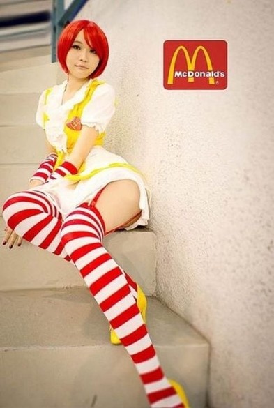 A red haired hotsy totsy anime McDonald's counter girl, except it's not cartoon, but a real, nibbleable person.