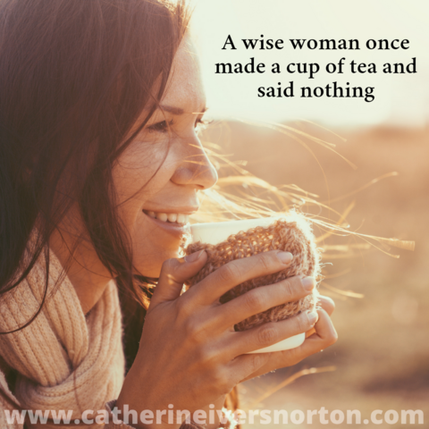 A woman lit by sunlight smiles as she holds a teacup to her lips. The caption reads, "A wise woman once made a cup of tea and said nothing."