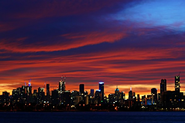 Thick red clouds hanging over Melbourne skyline