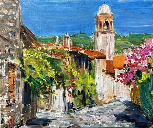 Colourful painting of a scenery of a village in Tuscany, Italy. In the foreground is a wide path, paved with stones coloured in greyish shades of green, blue, pink, purple and also white. Right next to the path is bright colourful foliage in the colours turquoise, green, light brown and pink. On the left are several small houses, coloured in shades of brown, grey, white and orange. These houses have a lot of bright foliage in various shades of green outside. On the horizon are green hills. The sky is clear blue.