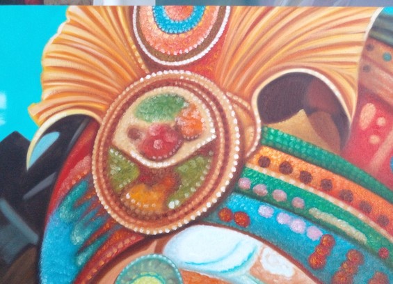 a close-up of the headdress, the beads of the beadwork in it