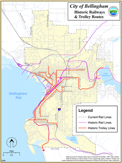 Map: City of Bellingham Historic Railways and Trolley Routes. The map shows extensive color-coded route coverage from Fairhaven south of Bellingham to Sunset Drive and further north and out to Lake Whatcom. Current rail lines are marked with a hashed gray line, historical rail lines are marked with a purple line, and historic trolley lines are marked in orange.