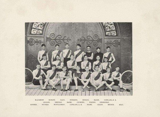 photo from 1894 showing three rows of cyclists in jerseys.