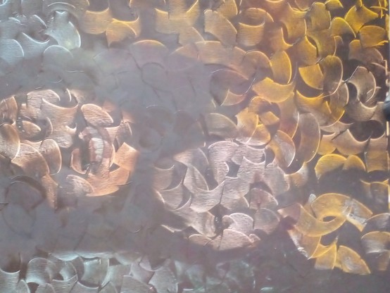 a close-up of the painting with patterns on it on the wall