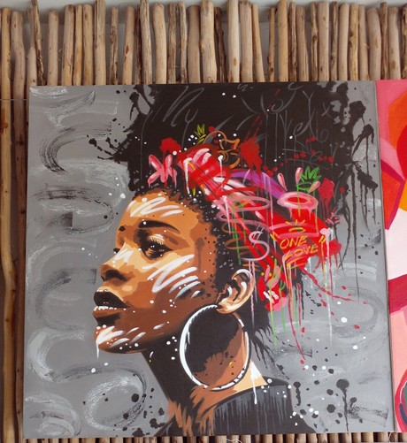 a painting of a woman, her dark hair tied up in a piece of red fabric, lots of prismatic colors and sketchy colored lines and splatter and drip effects are around her head, she is shown from the shoulders up, she is wearing large silver hoop earrings , she has white paint lines on her face