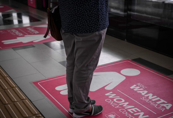 A person standing on the designated waiting area for the women only coach on MRT Kajang Line. / Photo from the linked article.
