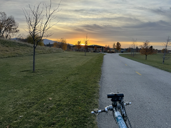 Sunrise over downtown Boise from the greenbelt near the Water Park. The front of my recumbent bike in the foreground.
