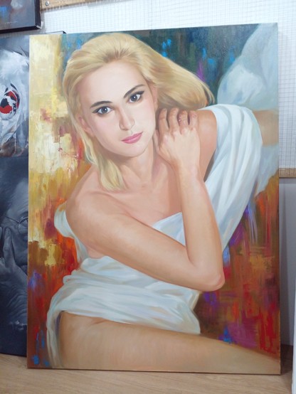 a painting of a woman with blonde hair, a white robe draped loosely over her body, the background is different tones of gold, red, and blue, the woman has her right hand resting on her left shoulder, looking at the viewer with brown eyes