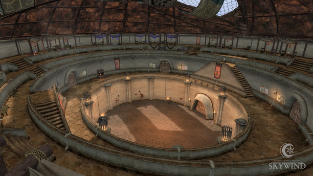The Arena canton pit is shown in the daytime. The pit in the center of the room is circular with dirt flooring. The floor surrounding the pit is made of stone, and there are staircases leading up to another two tiers of floors above it. On the highest level, there are canopied seating areas for spectators.