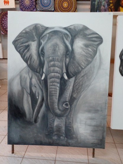 a black and white painting of an elephant approaching the viewer, another elephant behind it, the sky foggy