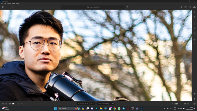 Zoomed in detail of my portrait of Simon Cheng speaking at a rally outside the Chinese Embassy in London, showing chromatic aberration and slightly nervous bokeh at f/1.8 with the Sony 50mm f/1.8.