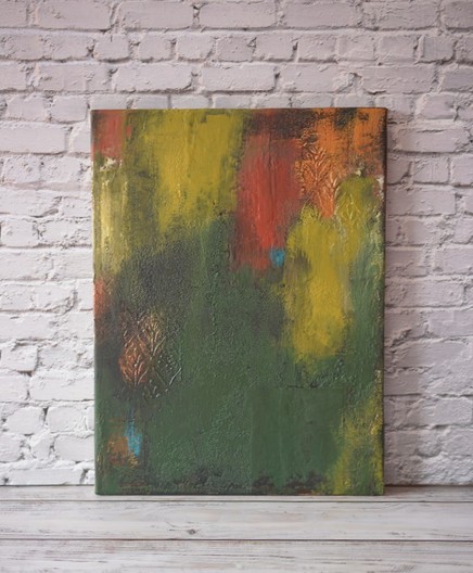 Abstract painting in autumn colours of mostly green, brown on the lower part and red, orange on the top part. It's done in a grungy style on a textured canvas.