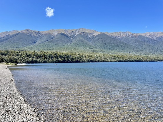 View from Kerr Bay to the St Arnaud Range, which features a scree slope in the shape of a parachute