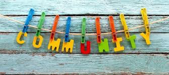 The word "COMMUNITY" written in letters individually pegged to a clothes line