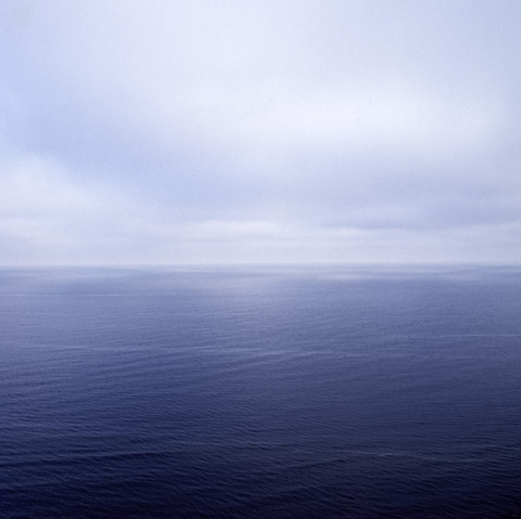 Colour photograph depicting a calmly rolling sea.
