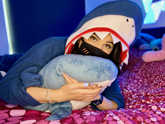 Shark costume pyjama, hugging IKEA shark. Blue nails and blue eyeshadow.
