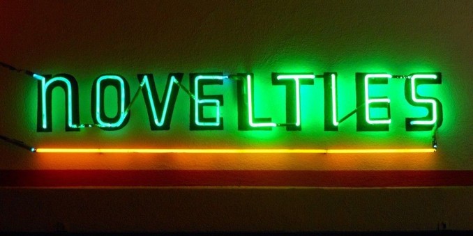 novelty at our meetings: a photograph of a neon sign saying "novelties". Image attribution: Flickr user dopey