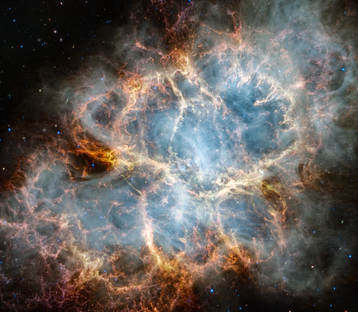 The Crab Nebula. An oval nebula with complex structure against a black background. On the nebula’s exterior, particularly at the top left and bottom left, lie curtains of glowing red and orange fluffy material. Its interior shell shows large-scale loops of mottled filaments of yellow-white and green, studded with clumps and knots. Translucent thin ribbons of smoky white lie within the remnant’s interior, brightest toward its center. The white material follows different directions throughout, including sometimes sharply curving away from certain regions within the remnant. A faint, wispy ring of white material encircles the very center of the nebula. Around and within the supernova remnant are many points of blue, red, and yellow light.
