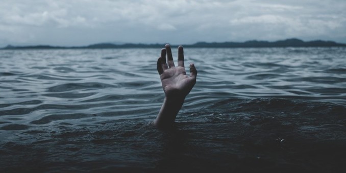 A hand struggling to rise above the water - What OpenAI and ChatGPT Tell Us About AI's Future