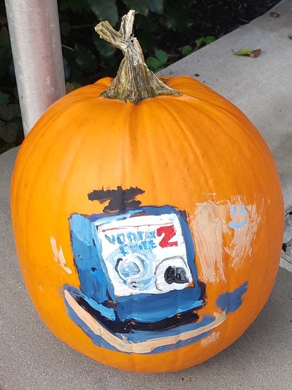 Pumpkin with the surface painted to display a Vortex Genie brand lab shaker.