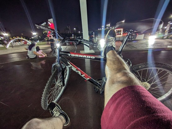 Me resting my legs on my bike
