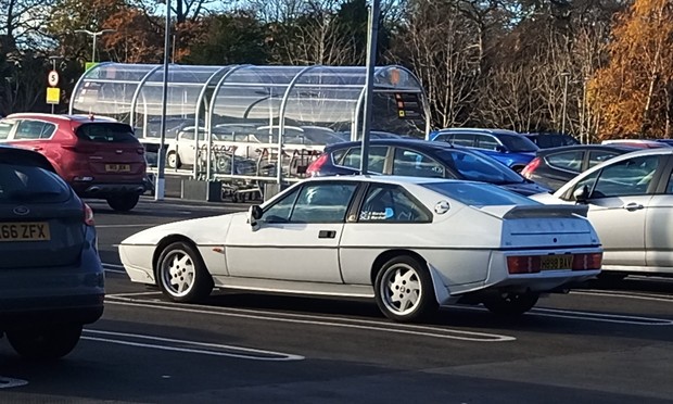 Photograph of a Lotus Excel in a supermarket car park.