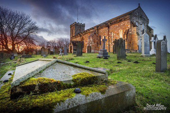 The Saxon church of St Mary the Virgin in Seaham, Co Durham – it's ancient stonework bathed in the warm hues of a setting sun.