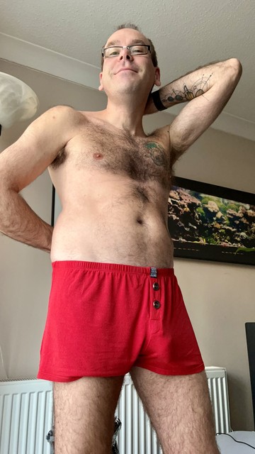 Hairy gay guy wearing red aussieBum boxers