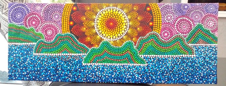 a painting of large mountains in the sea, done with large stipple dots, in the background is a large mandala representing the sun, it is orange and red and yellow colored, there are multi-colored wheels of color filling up the sky