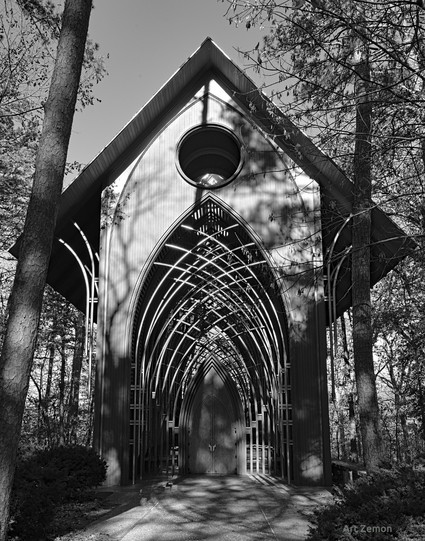 Black and white photo of the entrance to the Mildred B. Cooper Memorial Chapel. It is Gothic architecture done with modern concepts in wood and glass