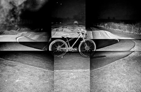 A black and white collage image of a bike in front of a pump track.