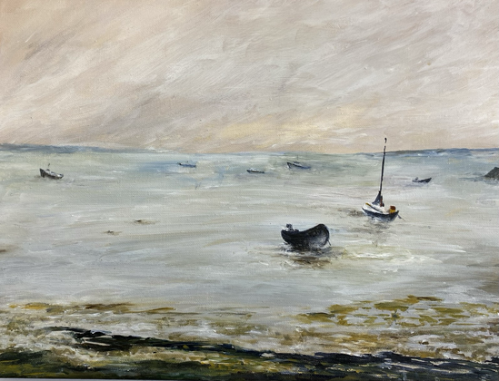 River estuary at low tide with mudflats and boats