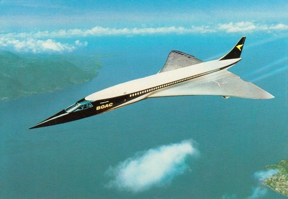 A sharpe angles jetliner slices through the sky like a dart. there are some cluds below, water, and green lands in either corner.